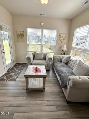 a living room with furniture and a large window