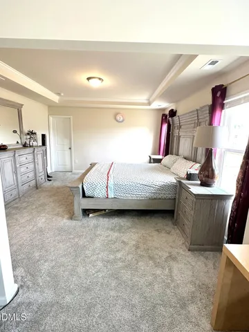 a bedroom with a bed and cabinets