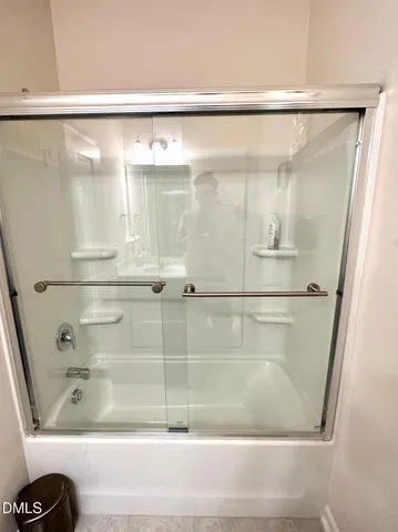 a view of yard with a house and sitting space