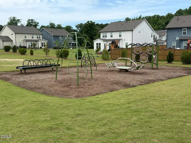 front view of a house with a garden