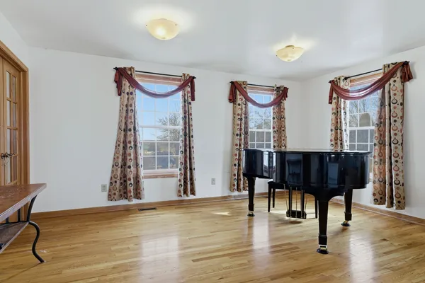 a view of a livingroom with furniture and hardwood floor