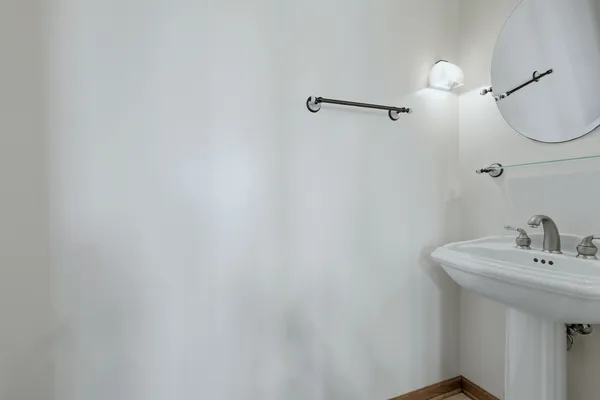 a bathroom with a sink and mirror