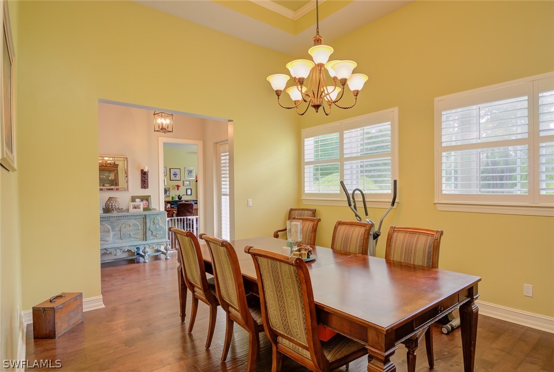 4030 Staley Road Fort Myers, FL 33905 - Photo 13 of 35 a view of a dining room with furniture and chandelier