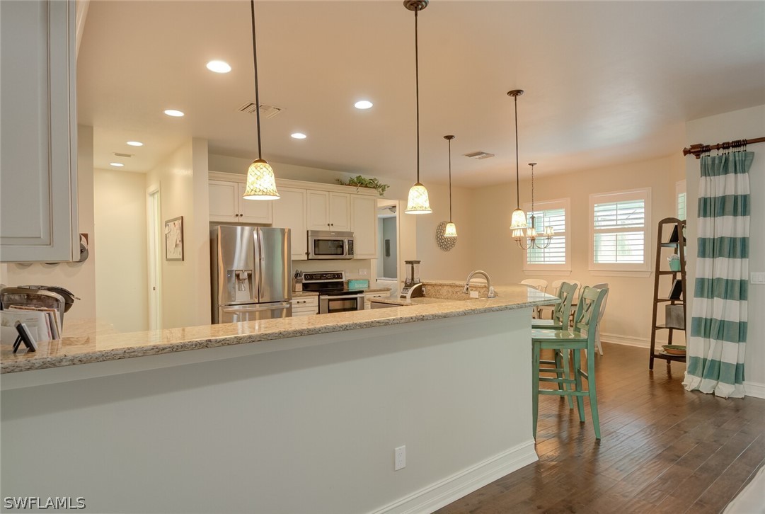 4030 Staley Road Fort Myers, FL 33905 - Photo 15 of 35 a large kitchen with a large window and stainless steel appliances