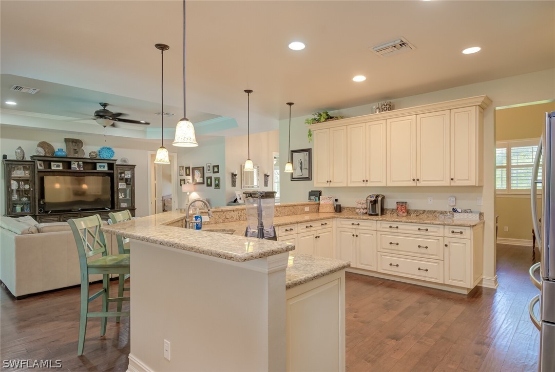 4030 Staley Road Fort Myers, FL 33905 - Photo 18 of 35 a kitchen with a sink stove and cabinets