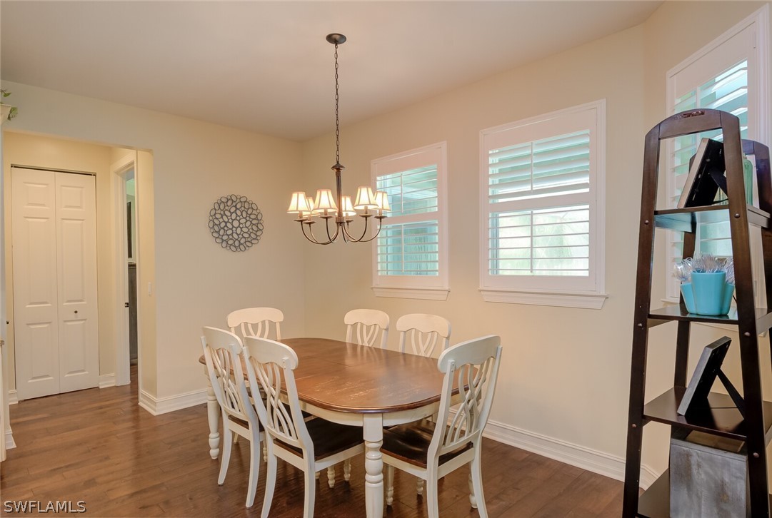 4030 Staley Road Fort Myers, FL 33905 - Photo 19 of 35 a view of a dining room with furniture window and wooden floor