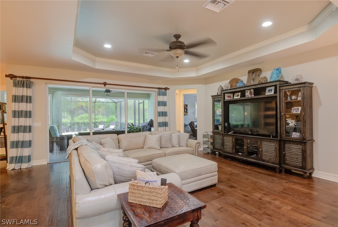 4030 Staley Road Fort Myers, FL 33905 - Photo 20 of 35 a living room with furniture a flat screen tv and a large window