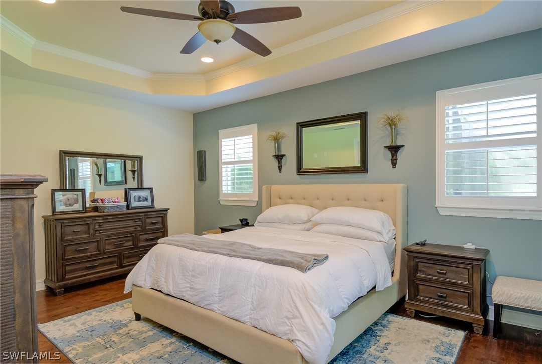 4030 Staley Road Fort Myers, FL 33905 - Photo 24 of 35 a bedroom with a bed and dresser with mirror
