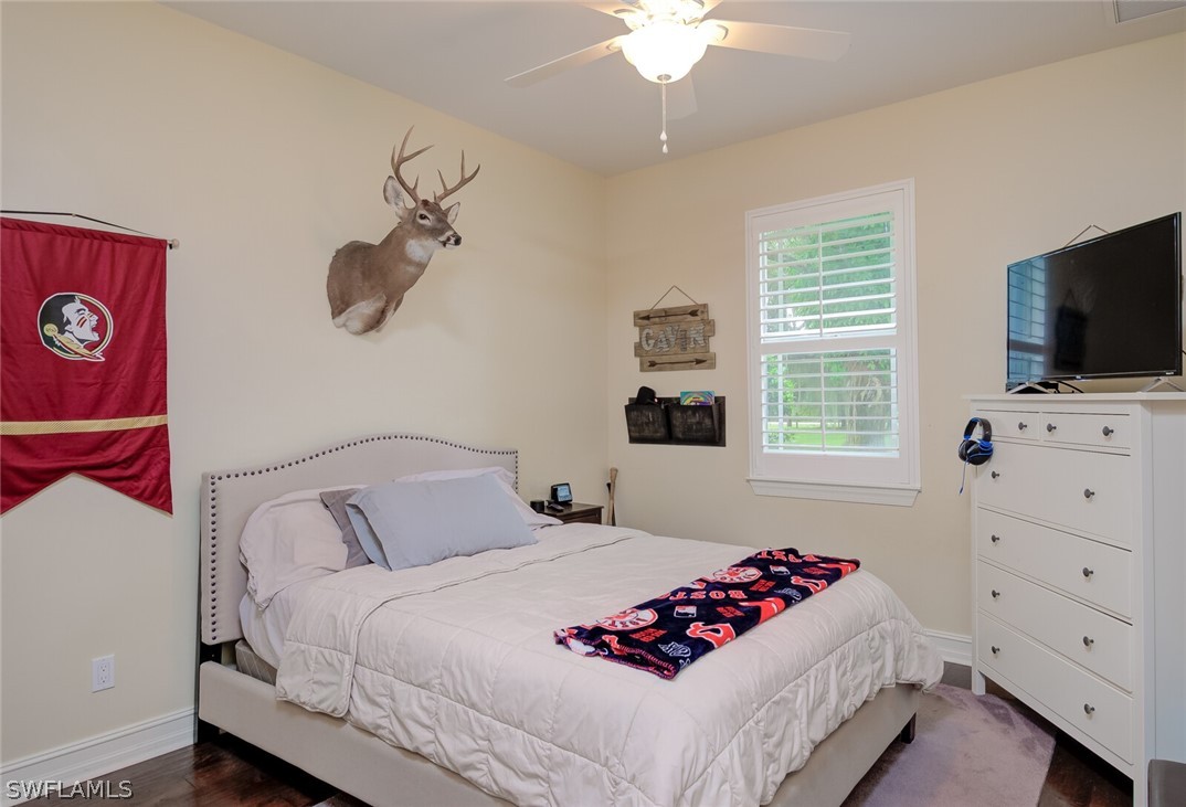 4030 Staley Road Fort Myers, FL 33905 - Photo 28 of 35 a bedroom with a bed and a flat screen tv