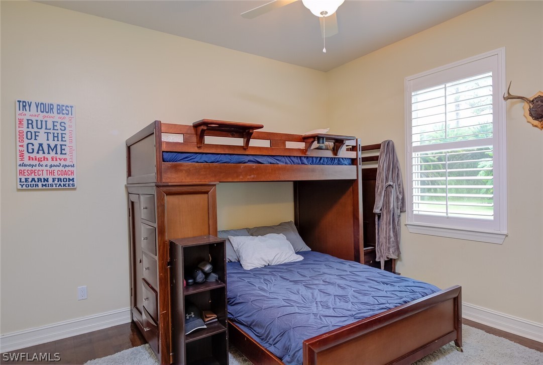 4030 Staley Road Fort Myers, FL 33905 - Photo 30 of 35 a bed sitting in a bedroom next to a window