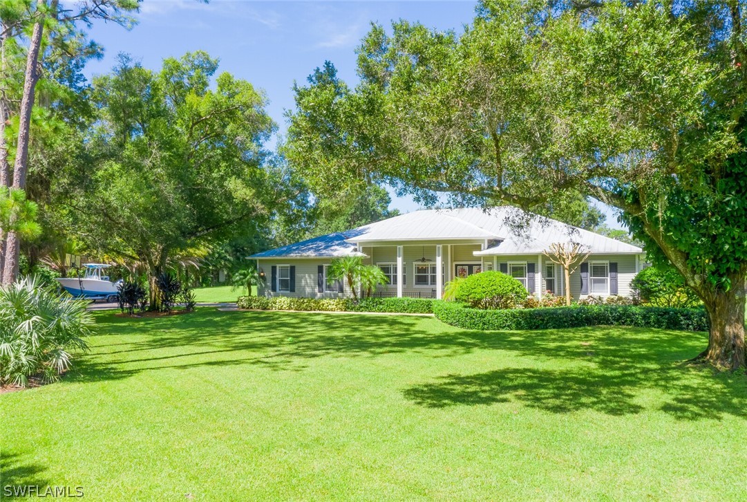 4030 Staley Road Fort Myers, FL 33905 - Photo 3 of 35 a front view of a house with a yard
