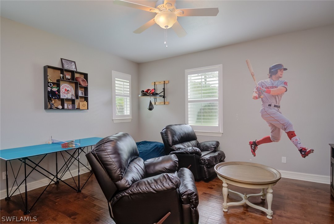 4030 Staley Road Fort Myers, FL 33905 - Photo 32 of 35 a living room with furniture a rug and a window