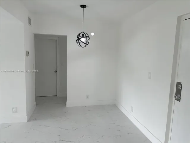 a view of a storage & utility room with windows