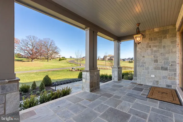 a view of a chandelier fan and entryway