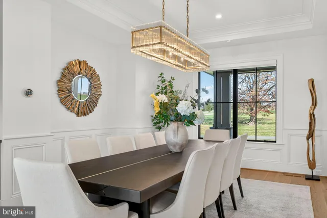 a spacious bedroom with a bed couch and a large window