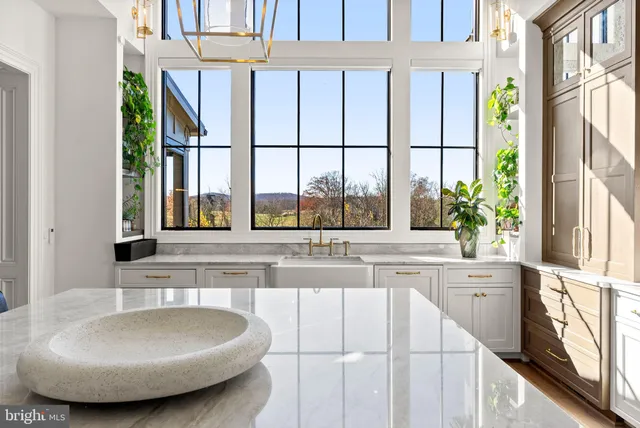 a view of a living room and floor to ceiling window