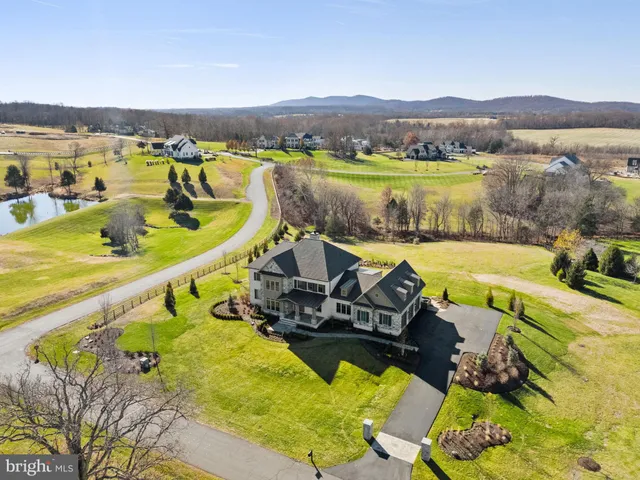 a view of a garden with a building in the background