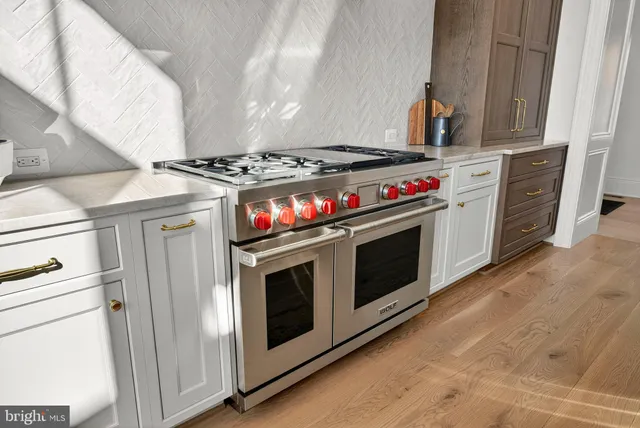 a dinning area with a table and chairs