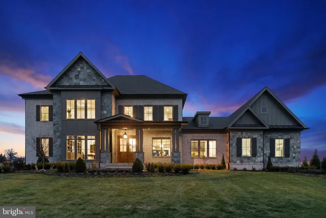 an aerial view of a house with garden space and street view