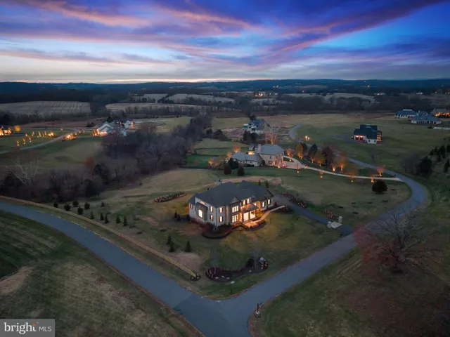 a kitchen with cabinets and a wooden floor