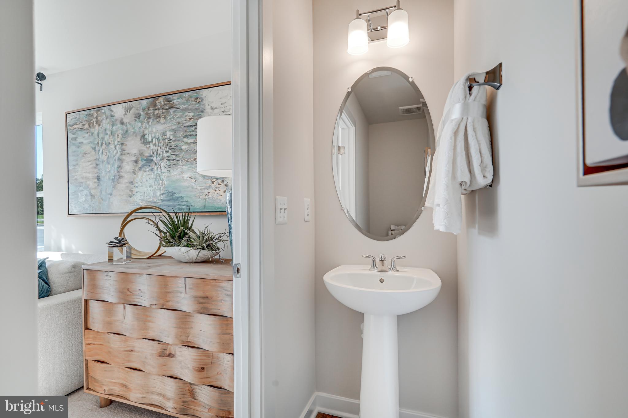 13658 Cobble Loop Woodbridge, VA 22193 - Photo 6 of 44 a bathroom with a sink and a mirror