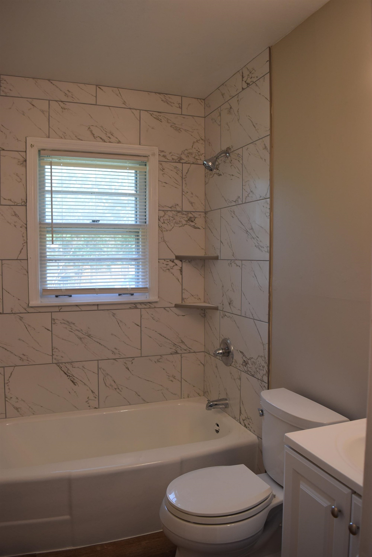 4144 Minden Road Memphis, TN 38117 - Photo 13 of 23 a bathroom with a toilet a sink and bathtub
