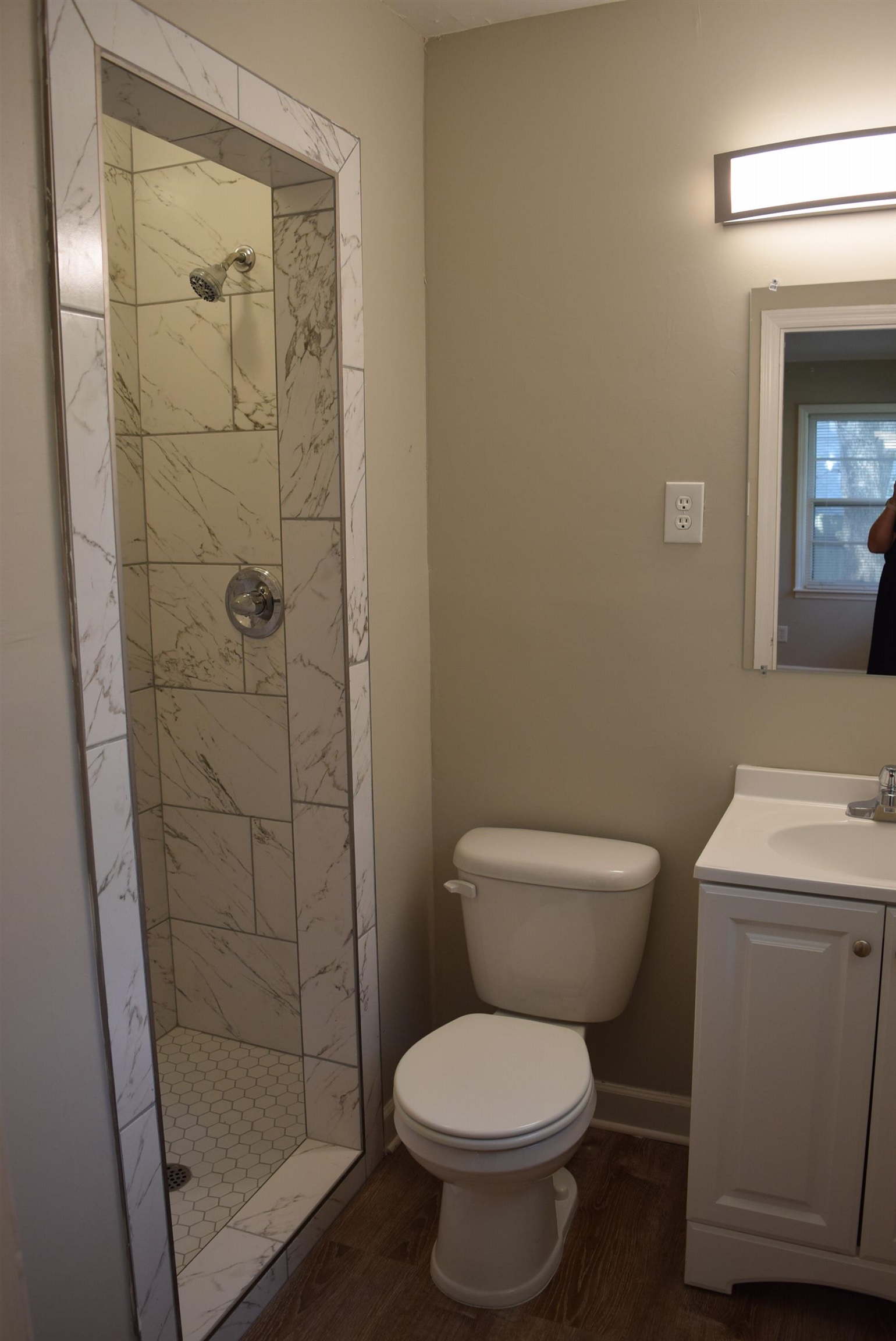4144 Minden Road Memphis, TN 38117 - Photo 17 of 23 a white toilet sitting next to a bathroom sink