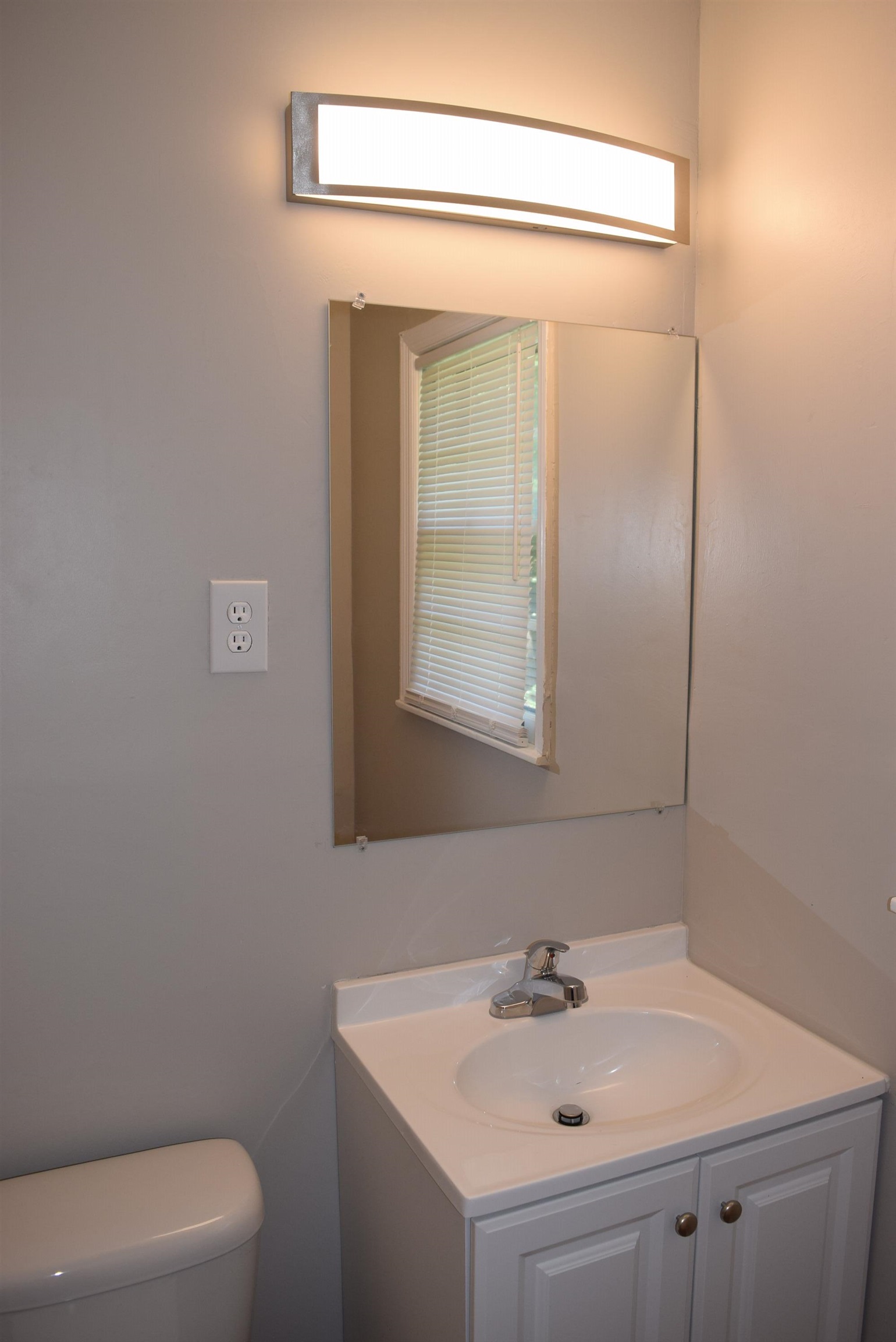 4144 Minden Road Memphis, TN 38117 - Photo 18 of 23 a bathroom with a sink a toilet and mirror