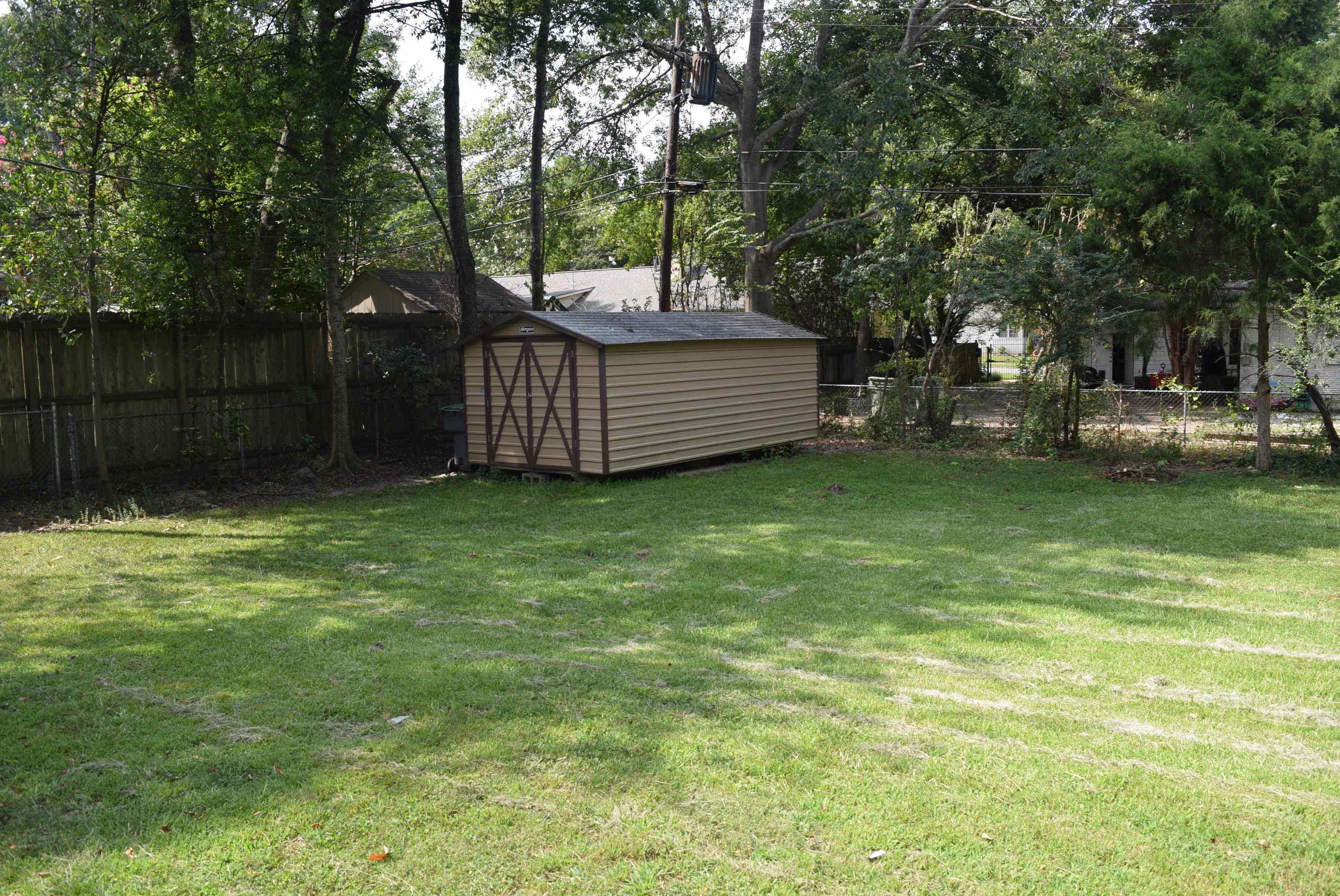 4144 Minden Road Memphis, TN 38117 - Photo 21 of 23 a view of a deck with a bench and trees