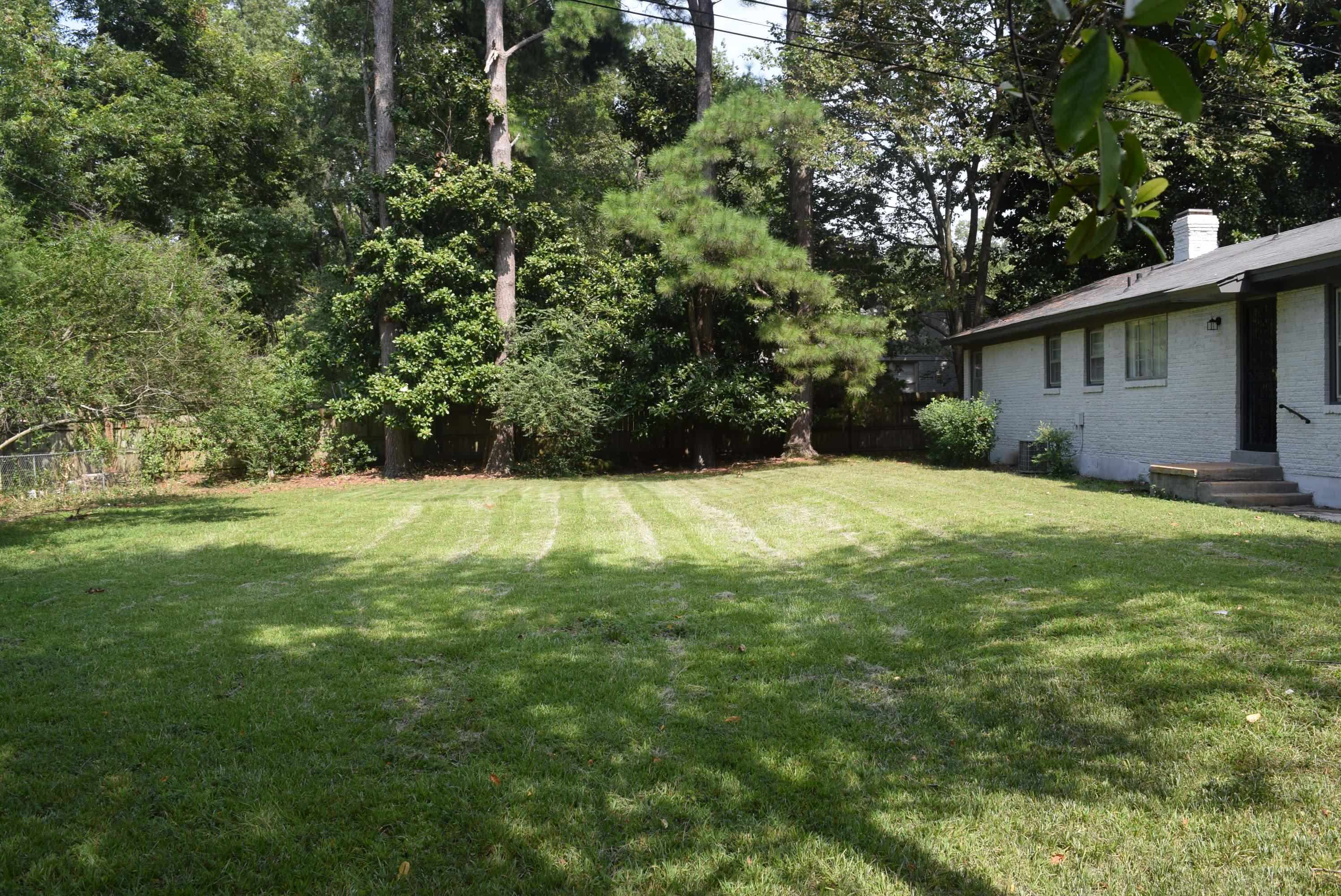 4144 Minden Road Memphis, TN 38117 - Photo 23 of 23 a backyard of a house with lots of green space