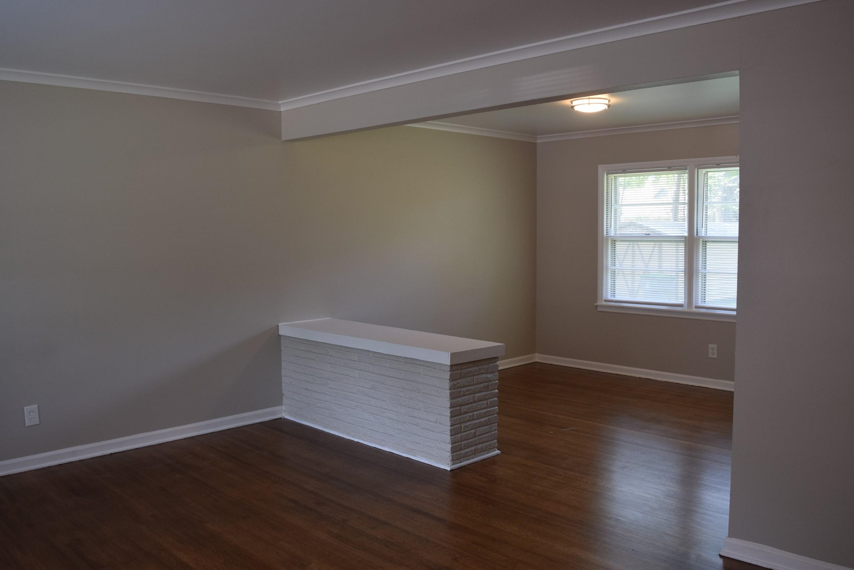 4144 Minden Road Memphis, TN 38117 - Photo 3 of 23 an empty room with wooden floor and windows
