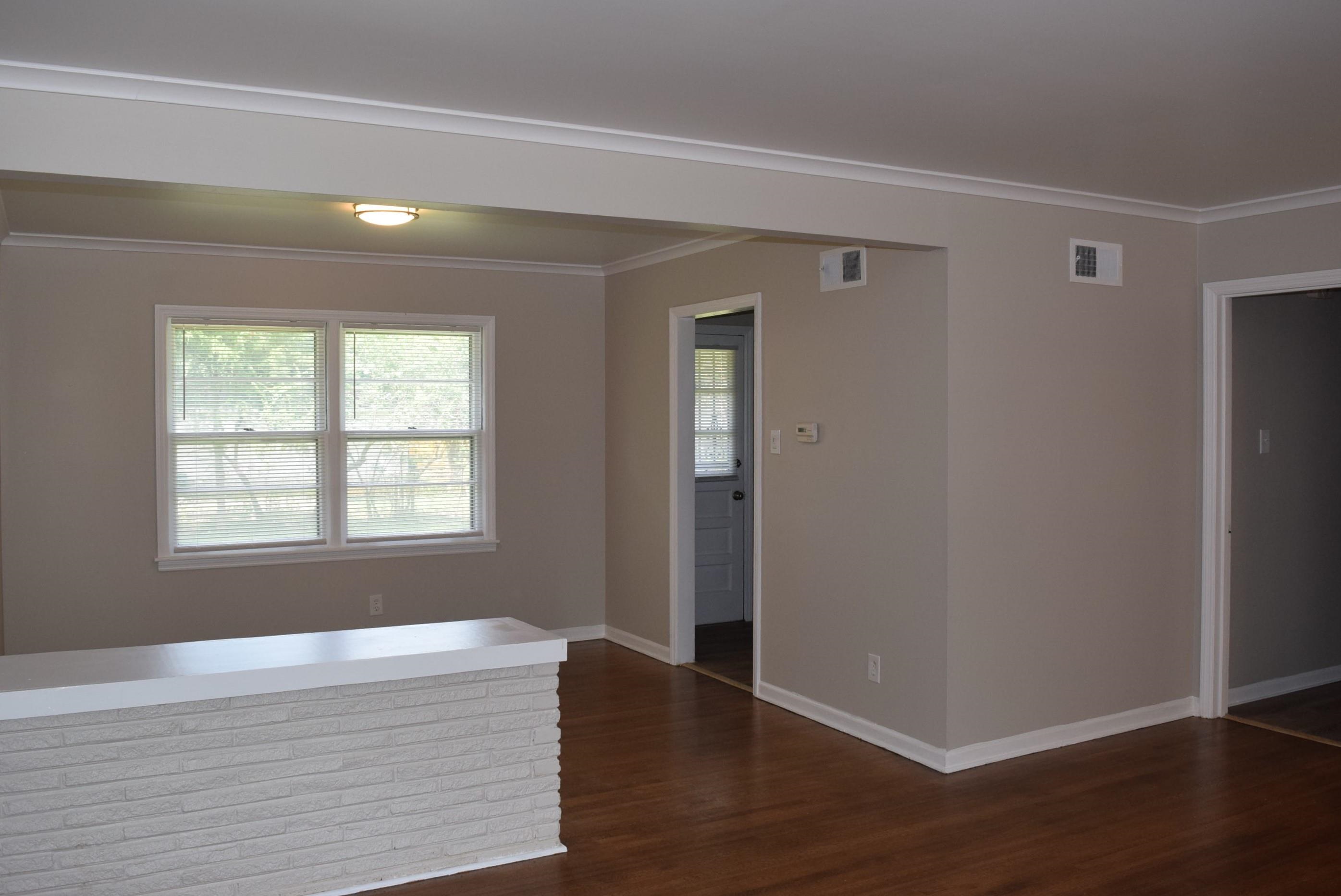 4144 Minden Road Memphis, TN 38117 - Photo 5 of 23 a view of an empty room with wooden floor and a window