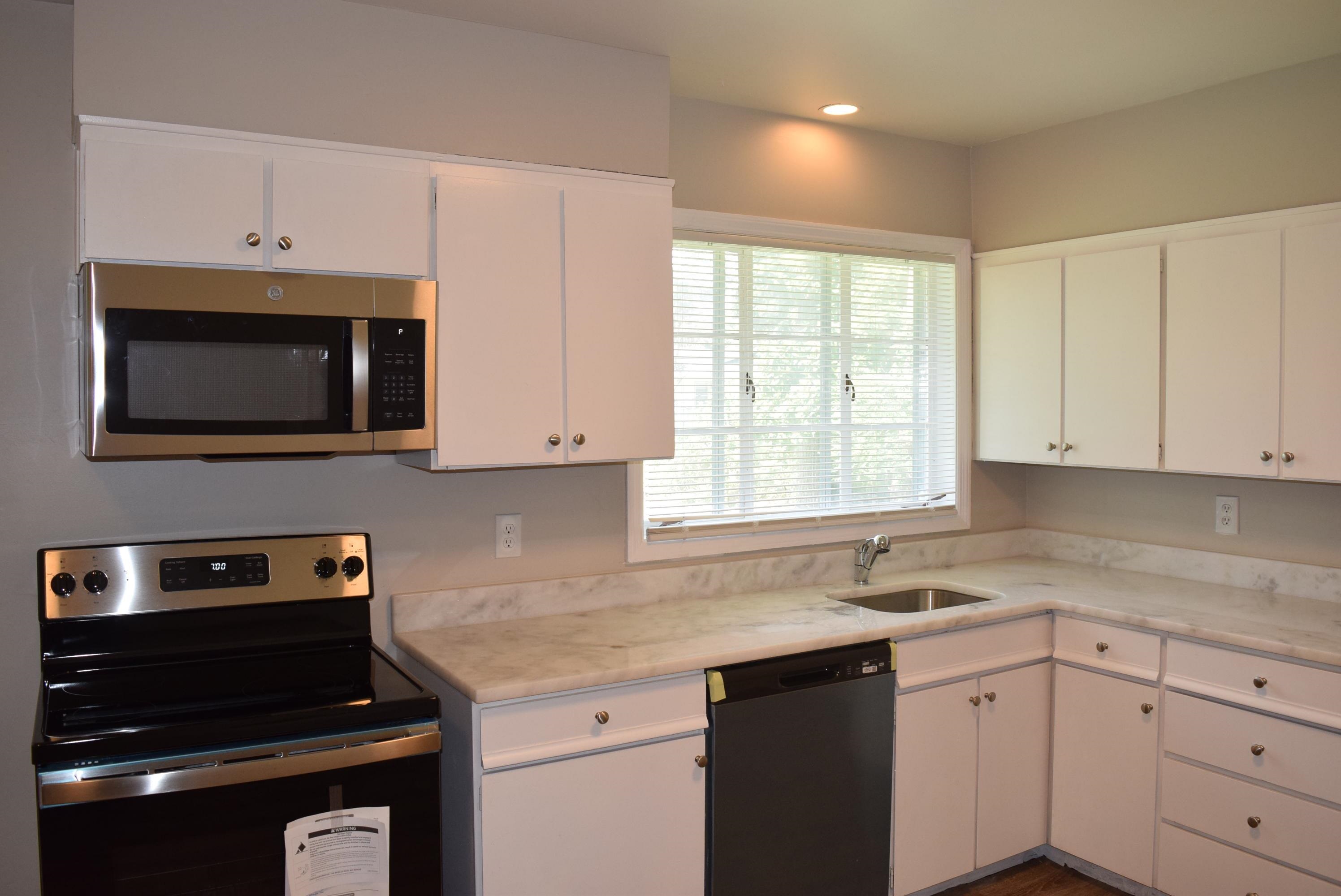 4144 Minden Road Memphis, TN 38117 - Photo 9 of 23 a kitchen with cabinets appliances a sink and a window