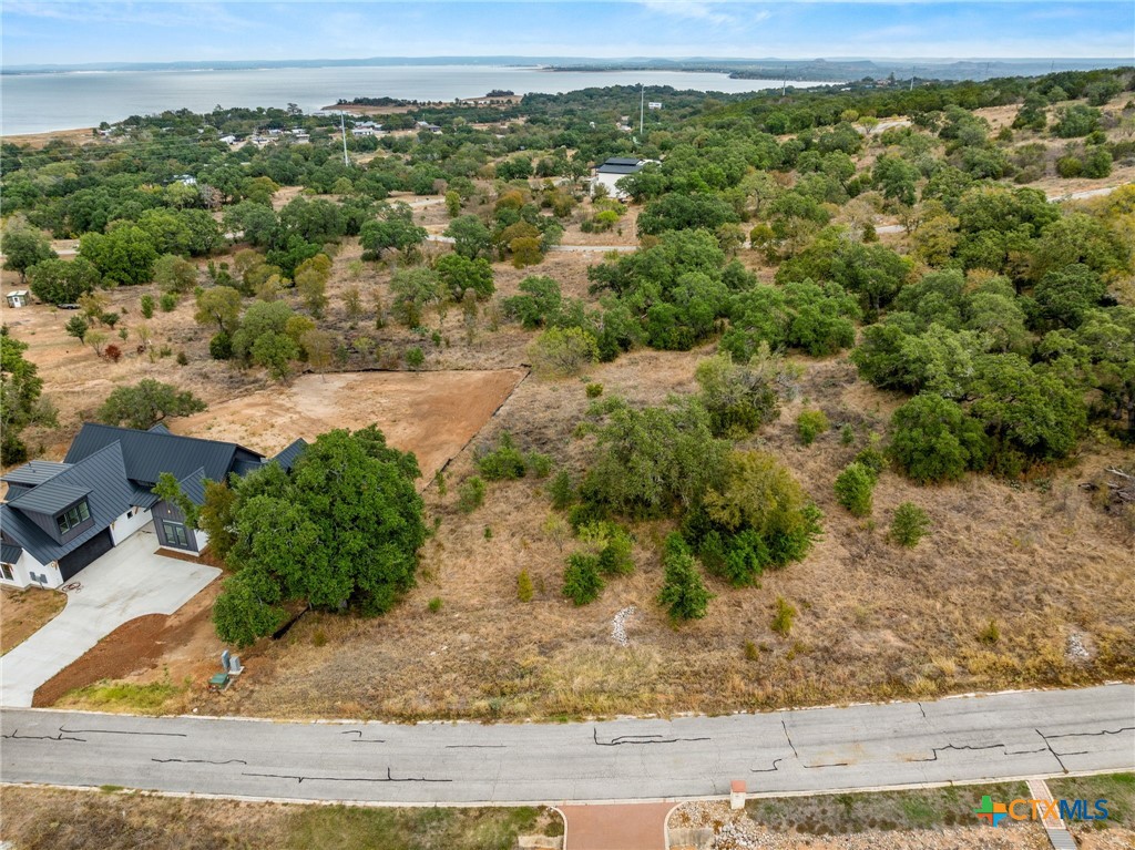 36 Keystone Ridge Buchanan Dam, TX 78609 - Photo 5 of 7 Front of the lot with a home recently built to the left.