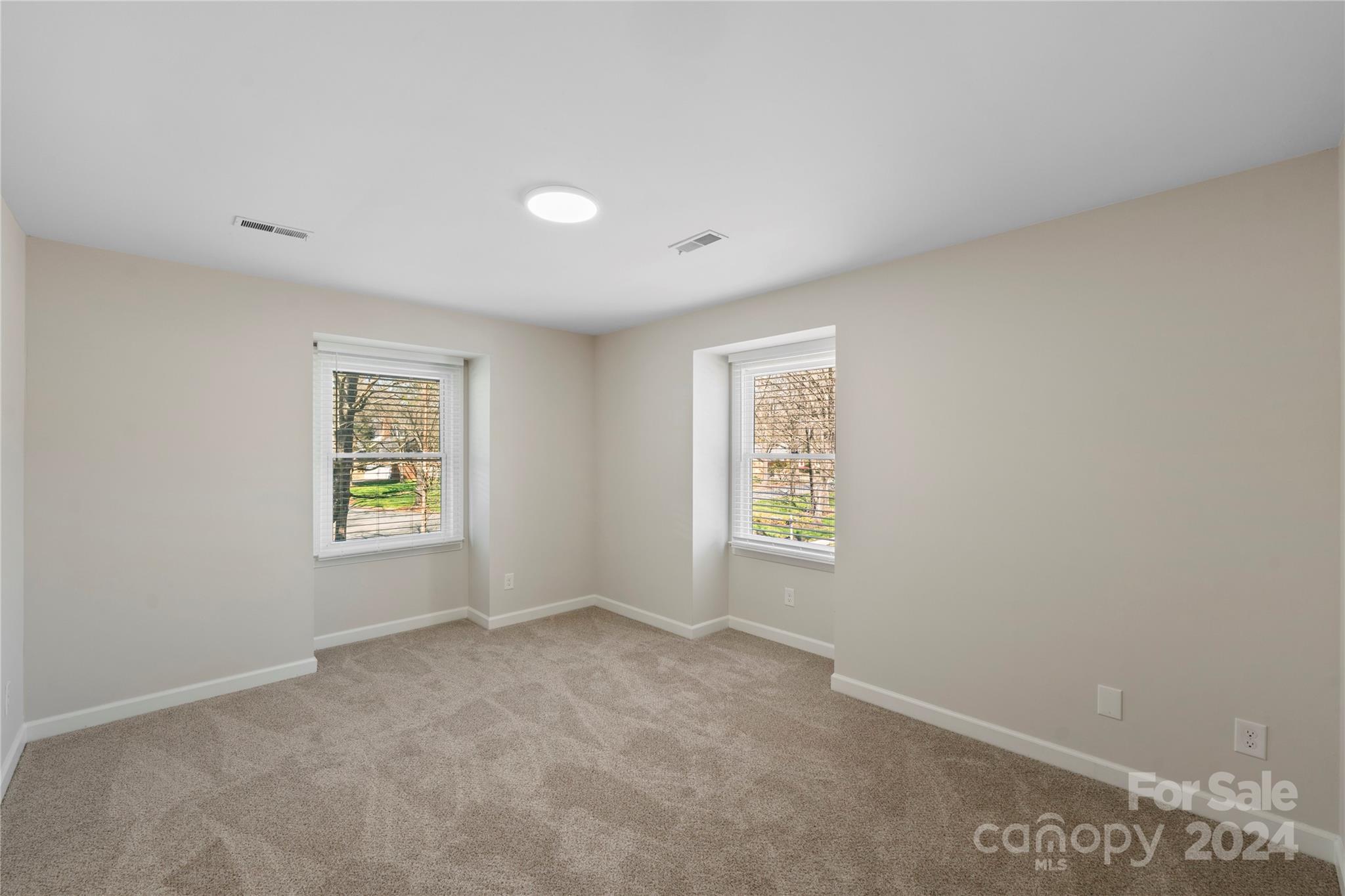 7802 Ridgeloch Place Charlotte, NC 28226 - Photo 14 of 31 a view of an empty room with a window