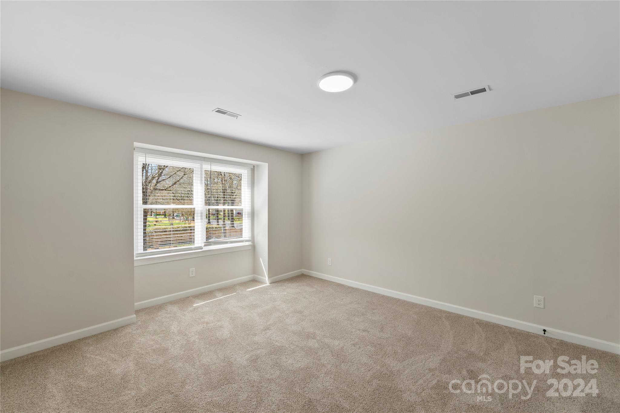 7802 Ridgeloch Place Charlotte, NC 28226 - Photo 15 of 31 an empty room with a window