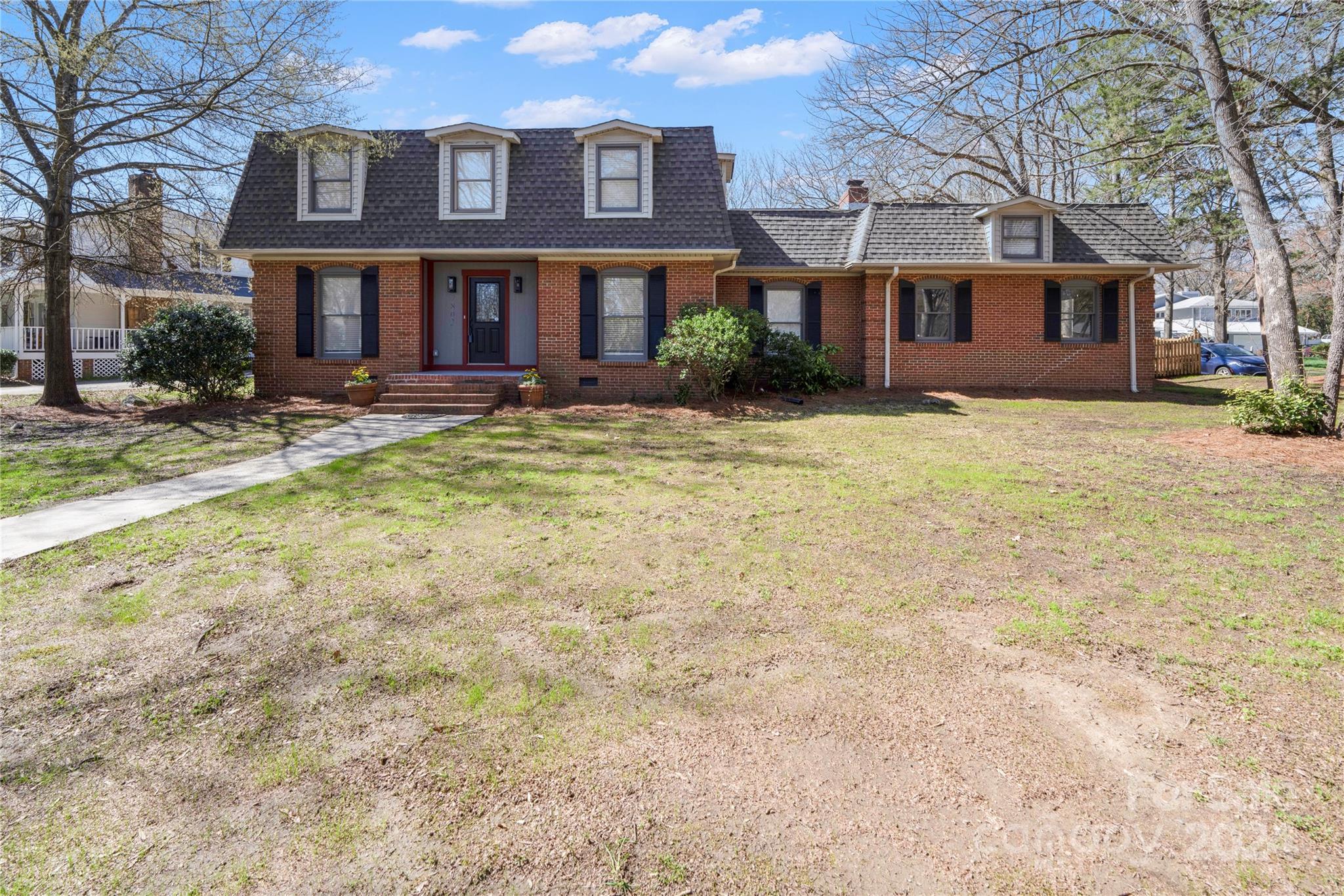 7802 Ridgeloch Place Charlotte, NC 28226 - Photo 2 of 31 a front view of a house with a yard