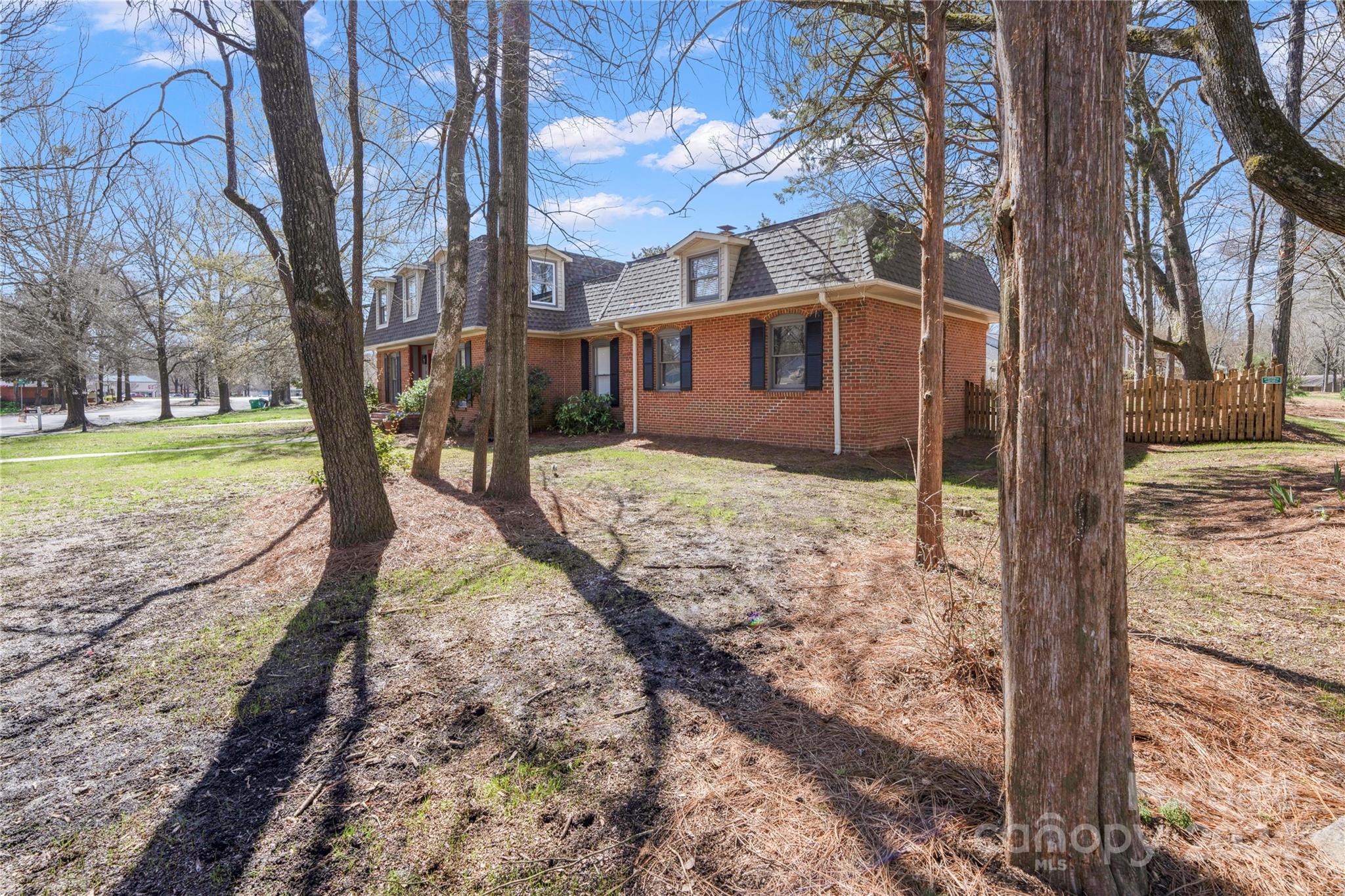 7802 Ridgeloch Place Charlotte, NC 28226 - Photo 22 of 31 a view of a house with a yard covered in snow