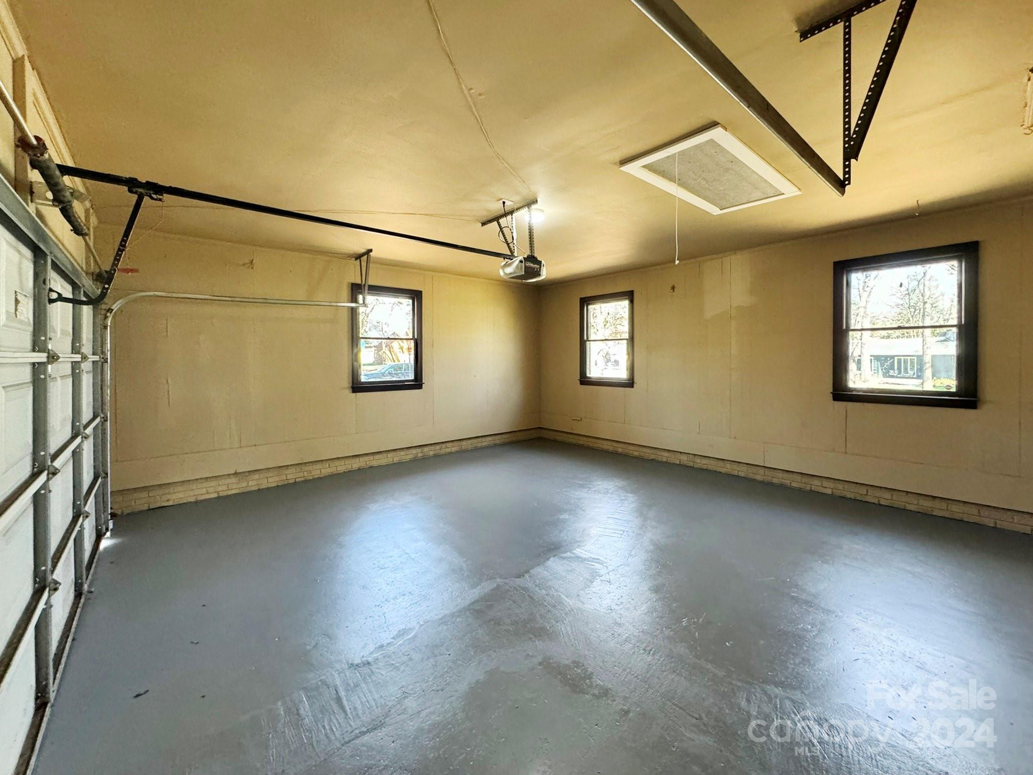 7802 Ridgeloch Place Charlotte, NC 28226 - Photo 23 of 31 an empty room with a empty space and windows