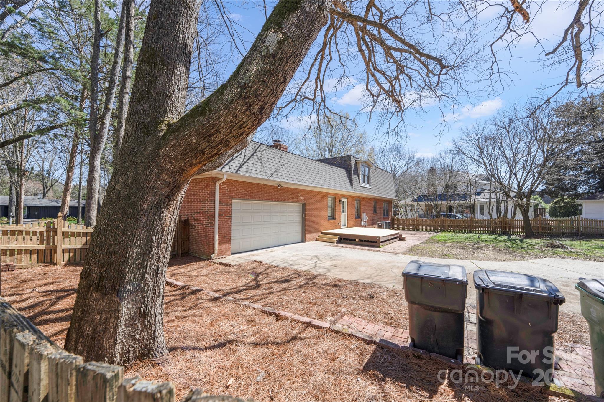 7802 Ridgeloch Place Charlotte, NC 28226 - Photo 25 of 31 a view of a house with a yard and sitting area