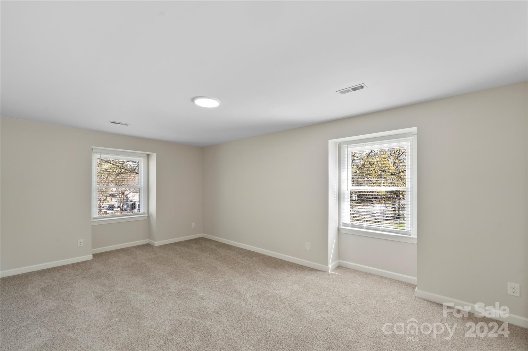 7802 Ridgeloch Place Charlotte, NC 28226 - Photo 3 of 31 an empty room with windows