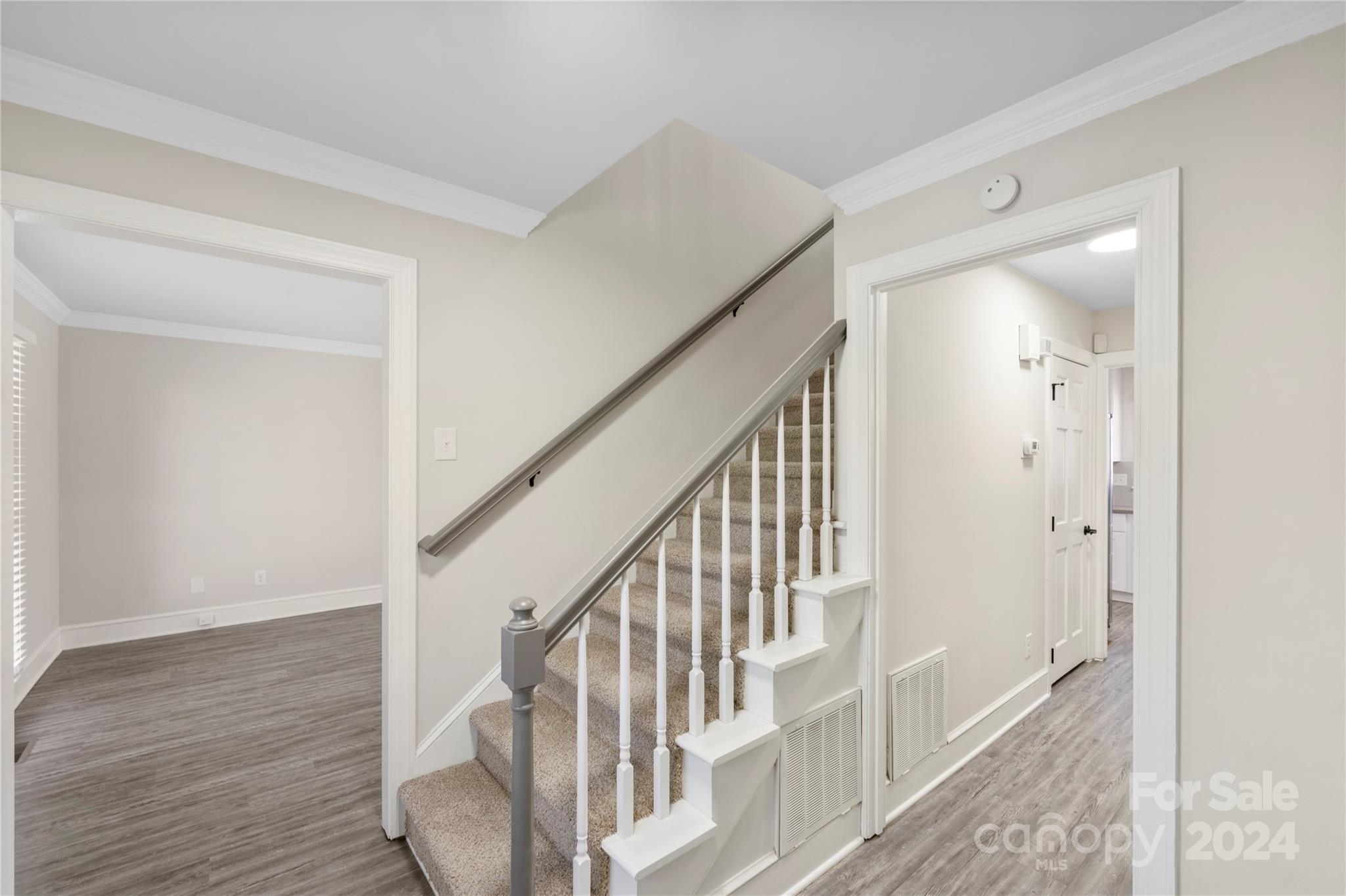 7802 Ridgeloch Place Charlotte, NC 28226 - Photo 4 of 31 a view of staircase with wooden floor and staircase