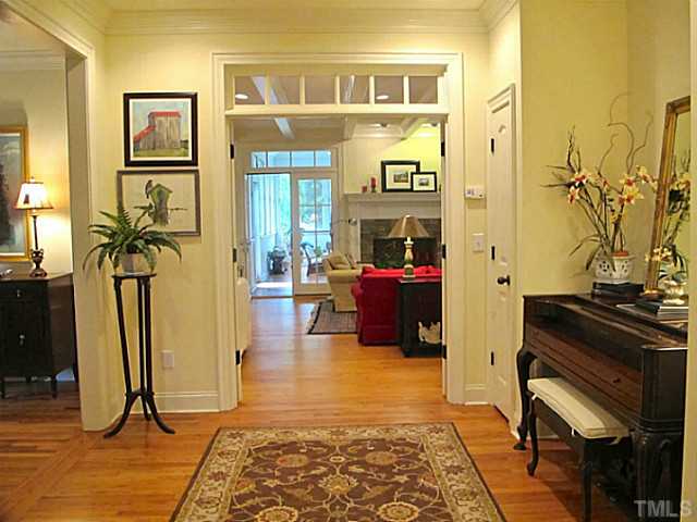 2532 Wake Drive Raleigh, NC 27608 - Photo 5 of 21 a living room with furniture a rug and a floor to ceiling window