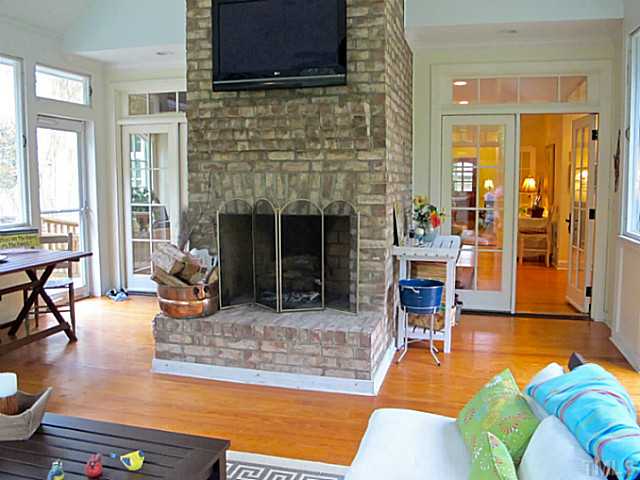 2532 Wake Drive Raleigh, NC 27608 - Photo 10 of 21 a living room with furniture and a fireplace