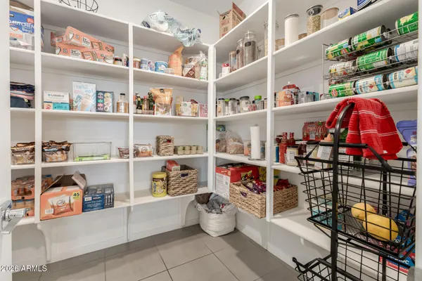 a spacious bedroom with a bed and a couch