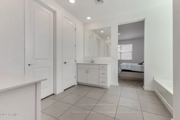 a bathroom with a bathtub and a sink