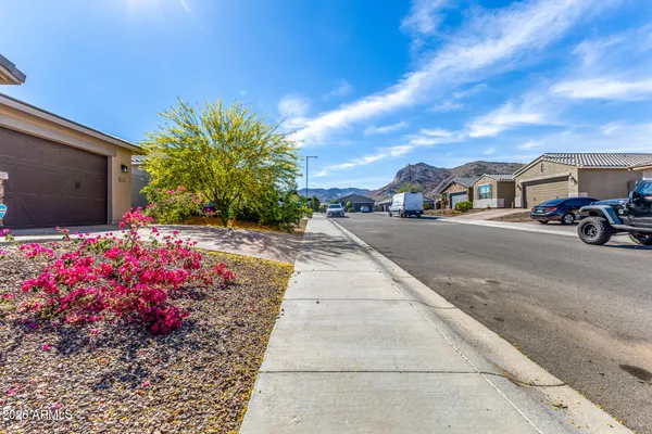 a front view of a house with yard