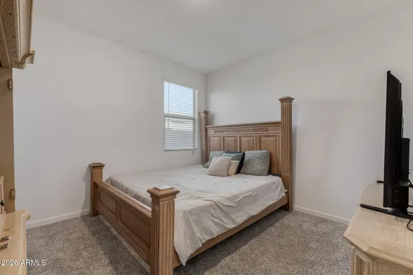 a bedroom with a bed and a cabinets