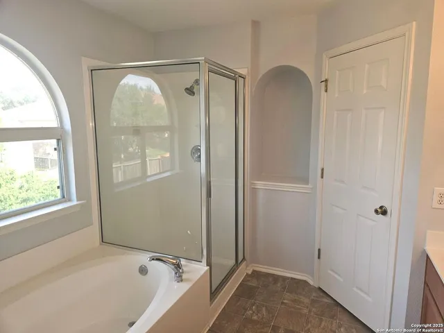 a bathroom with a sink vanity and mirror