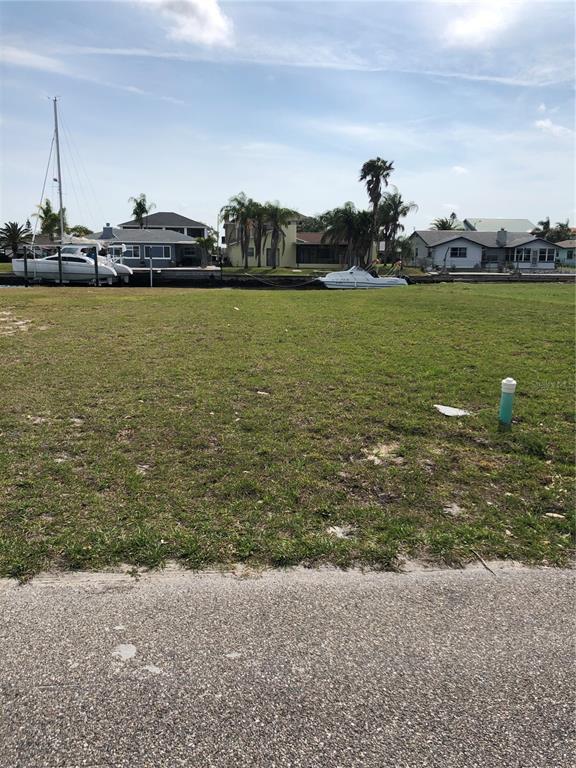 5834 Beverly Drive Hudson, FL 34667 - Photo 3 of 6 a view of a lake with houses in back